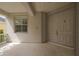 Charming covered front porch featuring classic double doors and a shuttered window at 20109 Bay Cedar Ave, Tampa, FL 33647