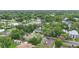 Aerial shot showcasing the property's location among lush trees at 204 W Calhoun St, Plant City, FL 33563