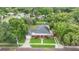 Aerial view of a home with a front porch and green lawn at 204 W Calhoun St, Plant City, FL 33563