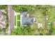 Aerial view of a home with a well-maintained yard and mature trees at 204 W Calhoun St, Plant City, FL 33563
