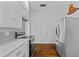 Well-lit kitchen featuring white cabinets, stainless steel appliances, and a stylish backsplash at 204 W Calhoun St, Plant City, FL 33563
