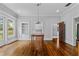 Bright living room with hardwood floors, built-in shelves, and ample natural light at 204 W Calhoun St, Plant City, FL 33563