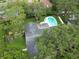 Aerial view of a home with a pool and lush, green backyard, showcasing its desirable outdoor features at 2273 Willowbrook Dr, Clearwater, FL 33764