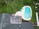 Aerial shot showcasing a kidney-shaped pool with lounge chairs next to the home at 2273 Willowbrook Dr, Clearwater, FL 33764