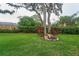 Well-maintained backyard with vibrant landscaping, providing a serene and private outdoor space at 2273 Willowbrook Dr, Clearwater, FL 33764