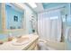 Bright bathroom with a tub and shower combo, vanity, and light-colored fixtures at 2273 Willowbrook Dr, Clearwater, FL 33764