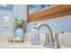Bathroom featuring a stylish faucet with decorative accessories and a blurred mirrored wall at 2273 Willowbrook Dr, Clearwater, FL 33764