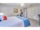 Comfortable bedroom featuring a Peloton bike, light-colored walls, and wood-look flooring at 2273 Willowbrook Dr, Clearwater, FL 33764