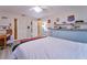 Themed bedroom with truck bed, fun artwork, wood-look flooring, and ample closet space at 2273 Willowbrook Dr, Clearwater, FL 33764
