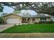 Charming single-story home featuring a well-manicured lawn and inviting curb appeal at 2273 Willowbrook Dr, Clearwater, FL 33764
