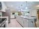 Open concept kitchen with stainless appliances and a view to the living room with fireplace at 2273 Willowbrook Dr, Clearwater, FL 33764