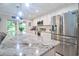Bright kitchen with stainless steel appliances, granite countertops, and an island with counter seating at 2273 Willowbrook Dr, Clearwater, FL 33764