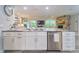 Modern kitchen with granite countertops, a stainless steel dishwasher and view to living room at 2273 Willowbrook Dr, Clearwater, FL 33764