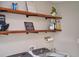 Laundry room with open wooden shelving, decorative items, modern washer, dryer and utility sink at 2273 Willowbrook Dr, Clearwater, FL 33764