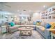 Spacious open-concept living area with a large sectional, fireplace, and view of the kitchen at 2273 Willowbrook Dr, Clearwater, FL 33764