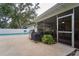 Outdoor patio with screened-in porch and grill, offering a comfortable space for entertaining and relaxation at 2273 Willowbrook Dr, Clearwater, FL 33764