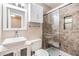 Contemporary bathroom featuring a vessel sink, stylish cabinets, and a glass-enclosed shower at 2526 W Jean St, Tampa, FL 33614