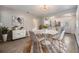 Dining area adjacent to kitchen, featuring modern table set and stylish decor at 2526 W Jean St, Tampa, FL 33614