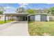 Charming single-story home with a covered carport and well-maintained lawn at 2526 W Jean St, Tampa, FL 33614