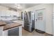 Updated kitchen with stainless steel appliances, white cabinets, and countertop space at 2526 W Jean St, Tampa, FL 33614
