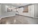 Kitchen with white cabinets, stainless steel appliances, and a connected dining area at 2526 W Jean St, Tampa, FL 33614
