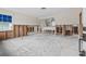 Spacious Living Room under renovation featuring a bright blue window and open layout at 260 42Nd Ave, St Pete Beach, FL 33706