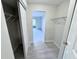 Large walk-in closet with wire shelving, adjacent to spacious room with gray flooring at 2625 State Road 590 # 1012, Clearwater, FL 33759