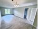 Open-concept living room with gray flooring, neutral walls and natural light at 2625 State Road 590 # 1012, Clearwater, FL 33759