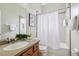 Bright bathroom featuring a shower and tub combination and a vanity with an integrated sink at 2708 Coastal Range Way, Lutz, FL 33559