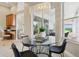 Bright and airy dining area showcases modern chandelier and leads to an outdoor entertainment space at 2708 Coastal Range Way, Lutz, FL 33559