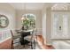 Charming dining room features hardwood floors, natural light, and stylish furnishings at 2708 Coastal Range Way, Lutz, FL 33559