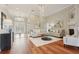 Inviting living room showcases hardwood floors, elegant furnishings, and a decorative chandelier at 2708 Coastal Range Way, Lutz, FL 33559