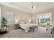 Serene main bedroom with plush carpeting, neutral tones, and access to the lanai at 2708 Coastal Range Way, Lutz, FL 33559