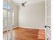 Bright office space featuring hardwood floors, a ceiling fan, and natural light at 2708 Coastal Range Way, Lutz, FL 33559