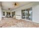 Outdoor patio with ceiling fans, built-in bar, access to the pool, and access to living room at 2708 Coastal Range Way, Lutz, FL 33559