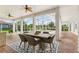 Outdoor patio area with brick floors, ceiling fans, and open view of pool and manicured yard at 2708 Coastal Range Way, Lutz, FL 33559