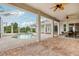 Outdoor pool with brick floors, screened enclosure, ceiling fans, and open view of manicured yard at 2708 Coastal Range Way, Lutz, FL 33559