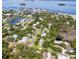 Aerial view of home in lush green neighborhood with waterfront access, showing its prime location at 272 Orange St, Palm Harbor, FL 34683