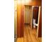 Bathroom with hardwood floors leading to toilet and sink at 272 Orange St, Palm Harbor, FL 34683