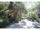 Home with brick accents and lush landscaping, creating a private oasis at 272 Orange St, Palm Harbor, FL 34683