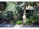 Exterior of home with lush, mature landscaping at 272 Orange St, Palm Harbor, FL 34683