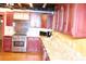 Updated kitchen features stainless steel appliances, granite countertops, and custom cabinetry at 272 Orange St, Palm Harbor, FL 34683
