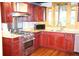 Updated kitchen features stainless steel appliances, granite countertops, and custom cabinetry at 272 Orange St, Palm Harbor, FL 34683