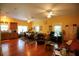 Bright, open-concept living space with hardwood floors, ceiling fans, and a defined dining area at 272 Orange St, Palm Harbor, FL 34683