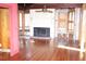 Bright living room with hardwood floors, a brick fireplace, and ample natural light at 272 Orange St, Palm Harbor, FL 34683