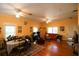 Spacious living room featuring hardwood floors, ceiling fans, and a cozy seating arrangement at 272 Orange St, Palm Harbor, FL 34683