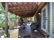 Relaxing covered porch with comfortable seating, perfect for outdoor living at 272 Orange St, Palm Harbor, FL 34683