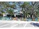 View of Ozona Brewing Company featuring colorful outdoor seating and lush trees at 272 Orange St, Palm Harbor, FL 34683