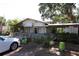 Charming storefront with a welcoming ramp and visible signage for NautiTees and other businesses at 272 Orange St, Palm Harbor, FL 34683