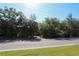 Home surrounded by mature trees, offering shade and a secluded feel at 272 Orange St, Palm Harbor, FL 34683